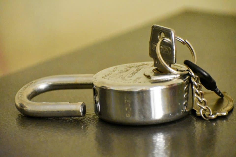 Silver Padlock On Silver Surface