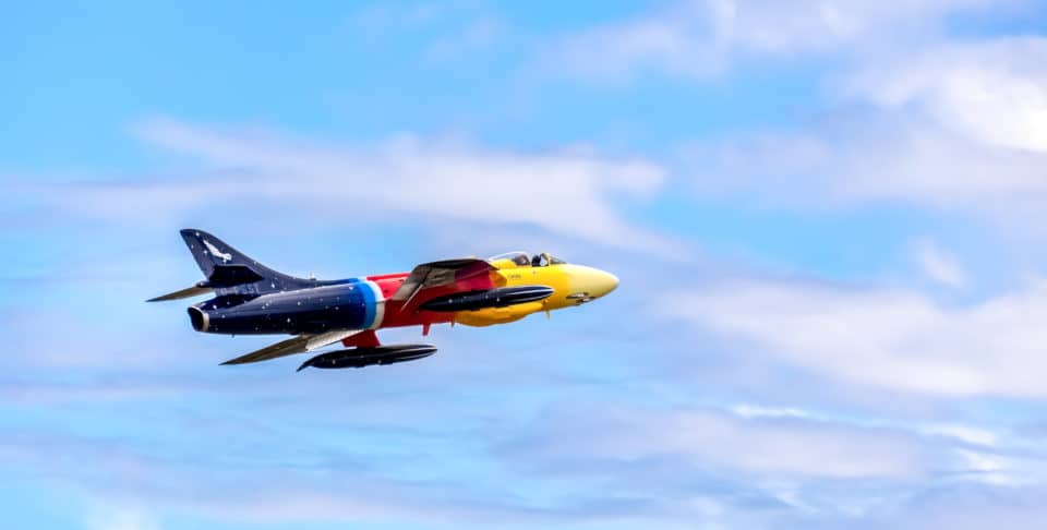 Yellow And Black Jet Plane In Mid Air